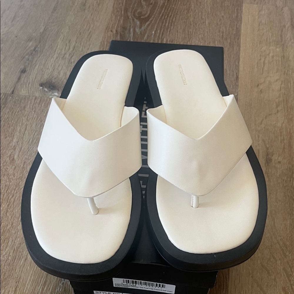 PrettyLittleThing Cream Leather Thong Sandals with Black Sole Size. 8